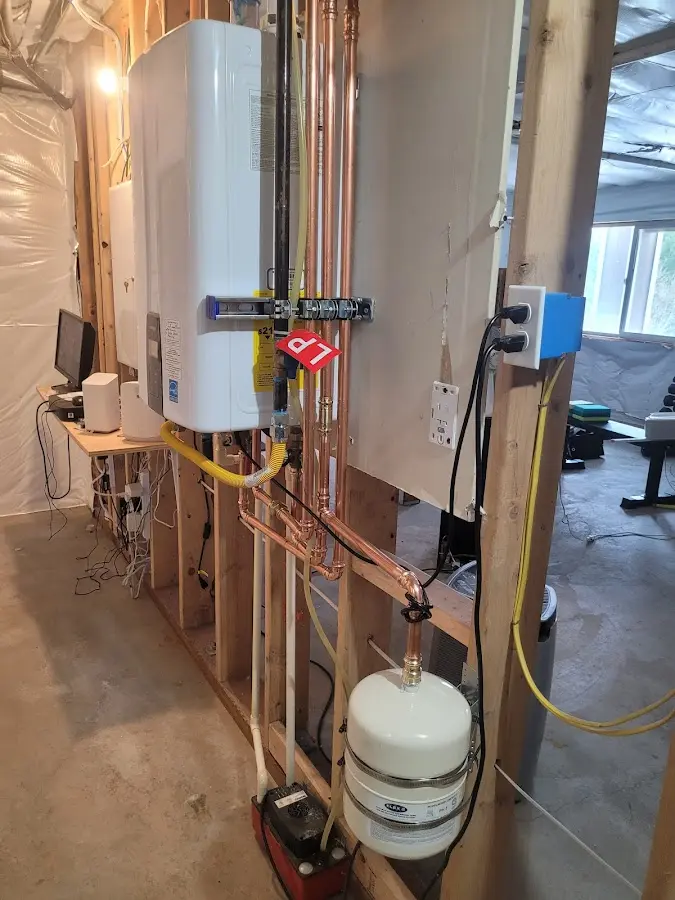 Licensed plumber repairing a kitchen sink in Olney